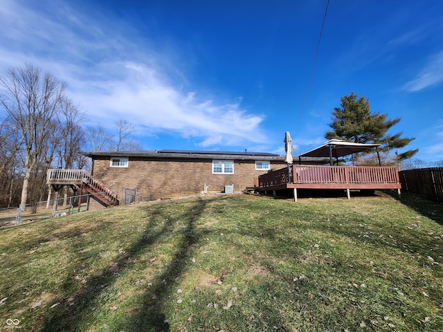 view of yard featuring a wooden deck and central AC unit