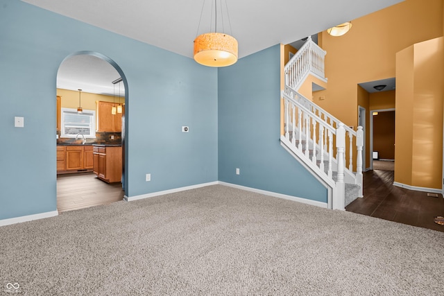 carpeted spare room with sink