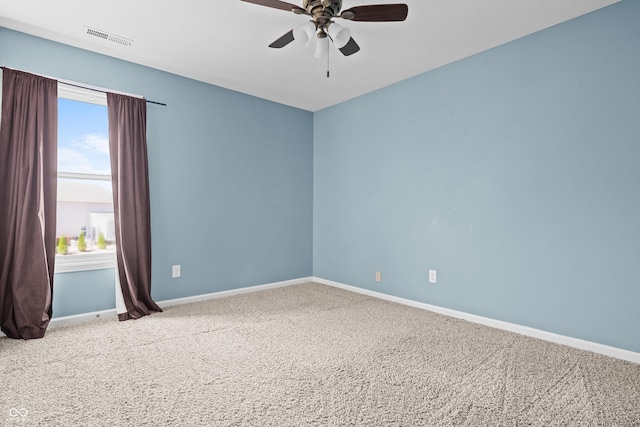 carpeted empty room featuring ceiling fan