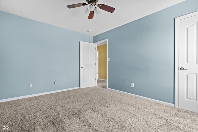 carpeted empty room with ceiling fan