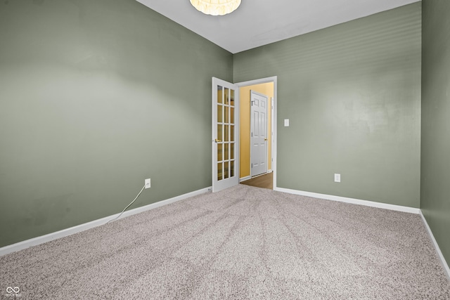 unfurnished room featuring carpet