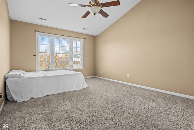 carpeted bedroom with vaulted ceiling and ceiling fan