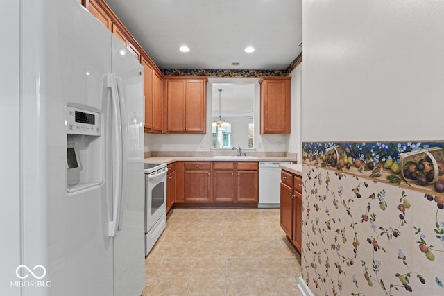 kitchen with white appliances and sink