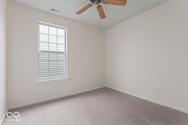 carpeted empty room with ceiling fan