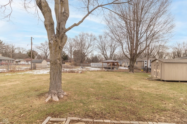 view of yard with a storage shed and a gazebo