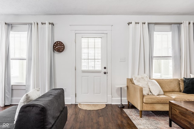 entrance foyer featuring dark hardwood / wood-style flooring and a textured ceiling