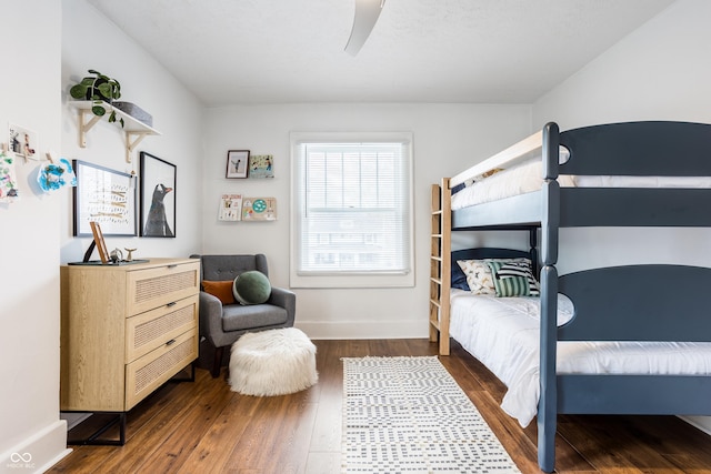 bedroom featuring dark hardwood / wood-style floors and ceiling fan