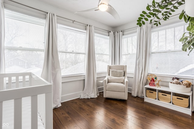 sunroom / solarium featuring ceiling fan