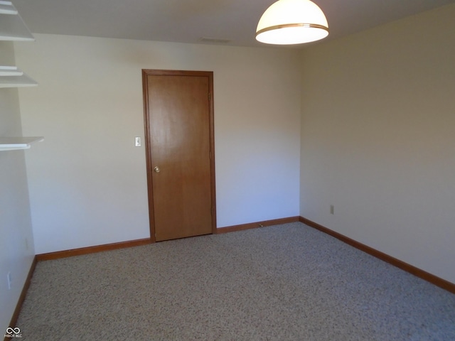 empty room with carpet flooring