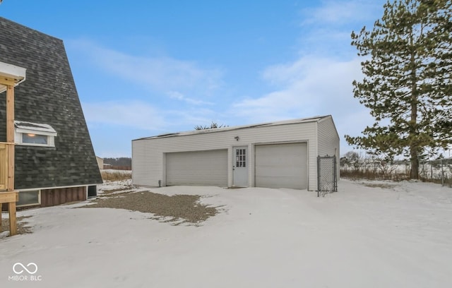 view of snow covered garage