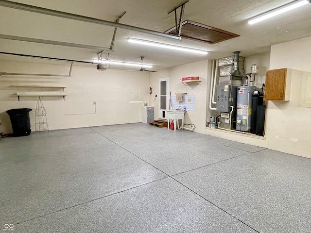 garage with sink, a garage door opener, and water heater