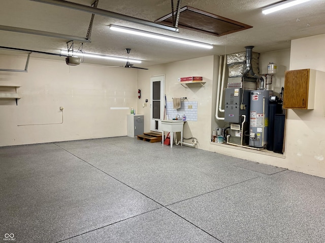 garage with water heater, sink, and a garage door opener