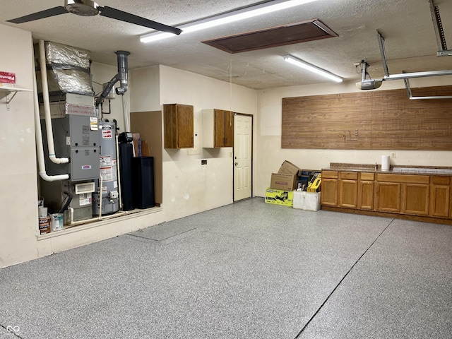 garage with a garage door opener and gas water heater