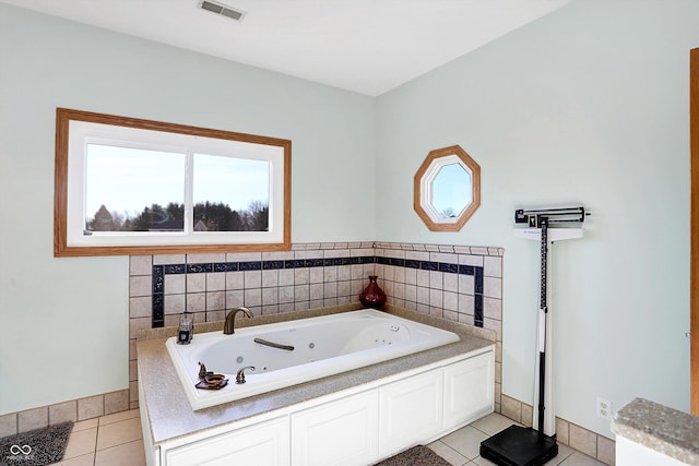 bathroom featuring tile patterned flooring and a bathtub