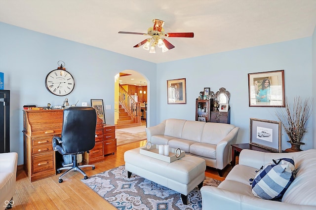 office space with ceiling fan and light wood-type flooring