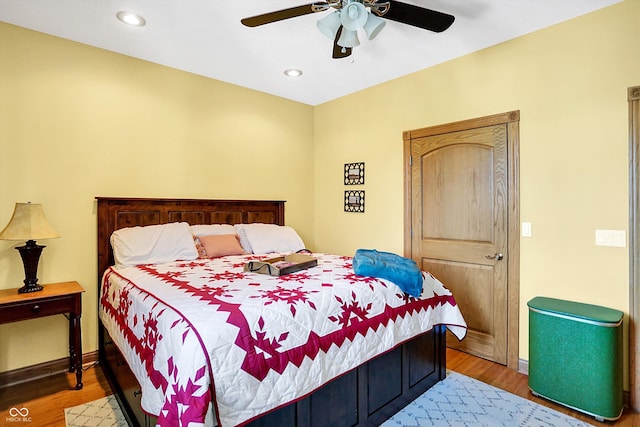 bedroom featuring hardwood / wood-style flooring and ceiling fan