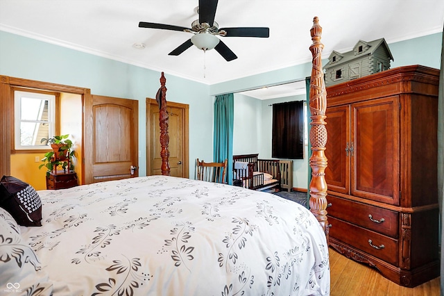 bedroom with light hardwood / wood-style flooring, ornamental molding, and ceiling fan