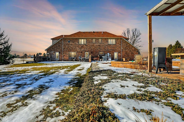 view of snow covered property