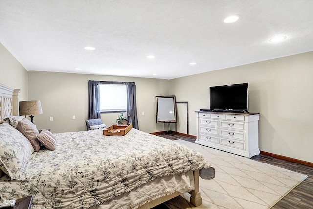 bedroom with dark wood-type flooring