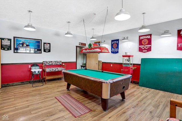 rec room with billiards and light hardwood / wood-style flooring