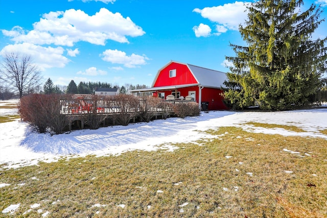 exterior space with an outbuilding and a lawn