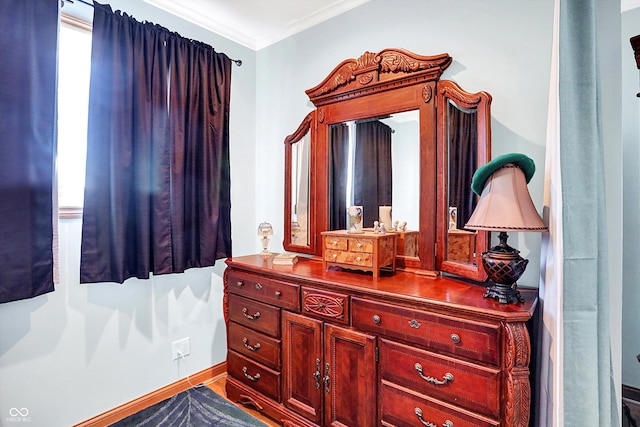 bathroom with vanity and ornamental molding