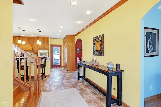 entryway featuring ornamental molding