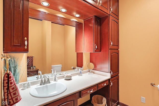 bathroom with vanity and toilet