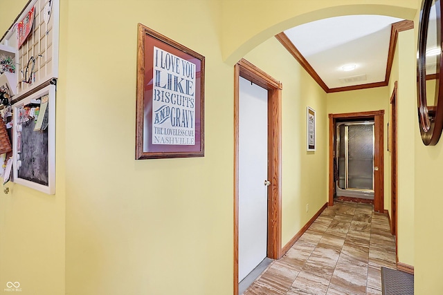 hallway featuring crown molding