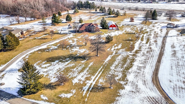 snowy aerial view with a rural view