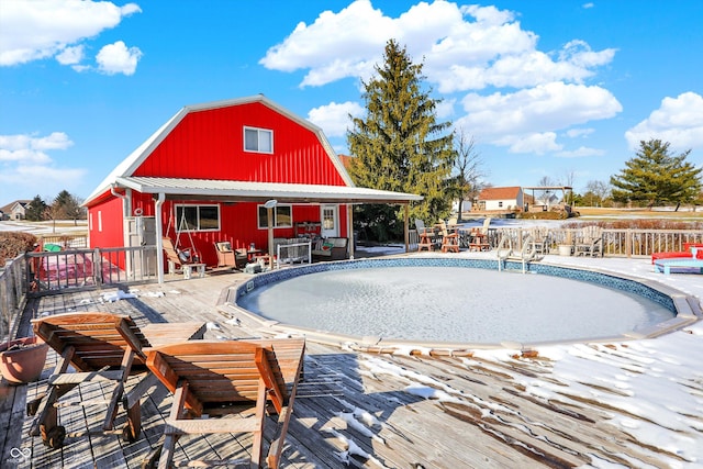 view of swimming pool featuring a deck