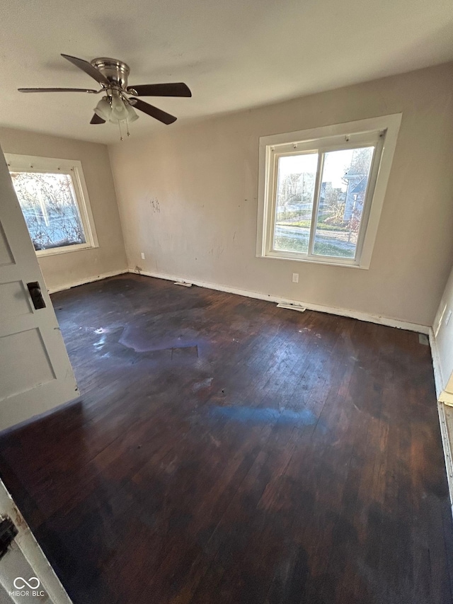 spare room with dark wood-type flooring