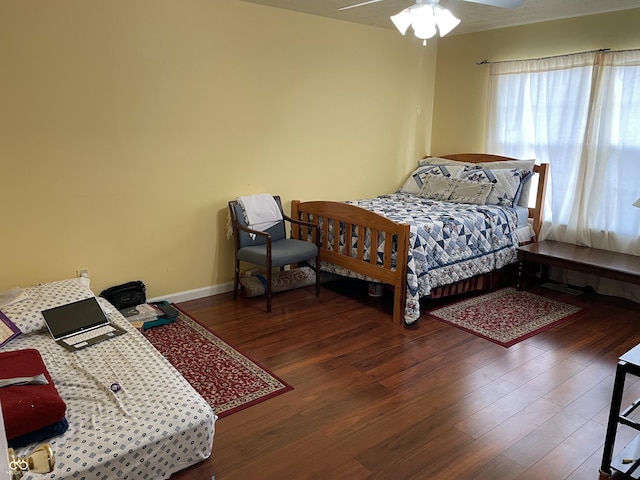 bedroom featuring dark hardwood / wood-style flooring and ceiling fan