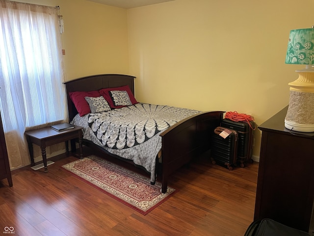 bedroom featuring dark wood-type flooring