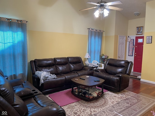 living room featuring ceiling fan, high vaulted ceiling, and hardwood / wood-style floors