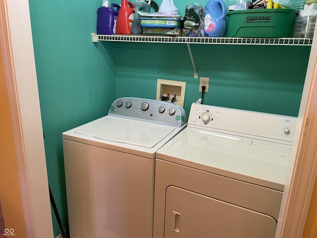 washroom featuring washer and clothes dryer