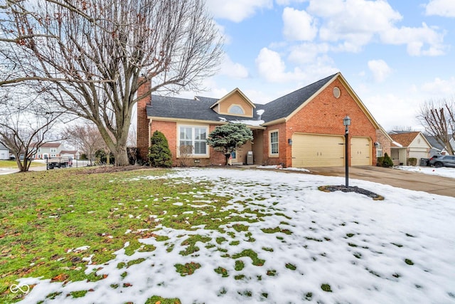 front of property with a garage and a yard