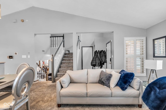 living room featuring vaulted ceiling and carpet