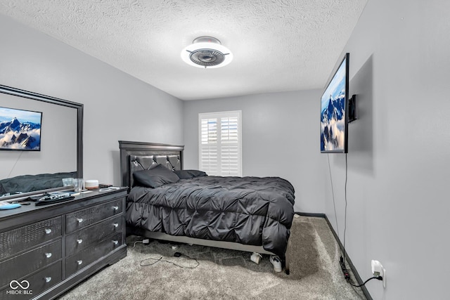 carpeted bedroom featuring a textured ceiling