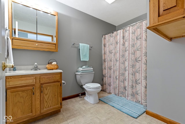 bathroom with vanity, toilet, and a shower with shower curtain