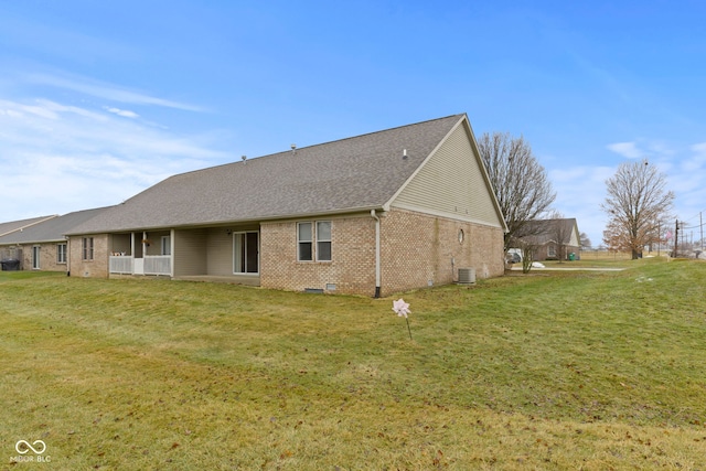 back of house with a yard