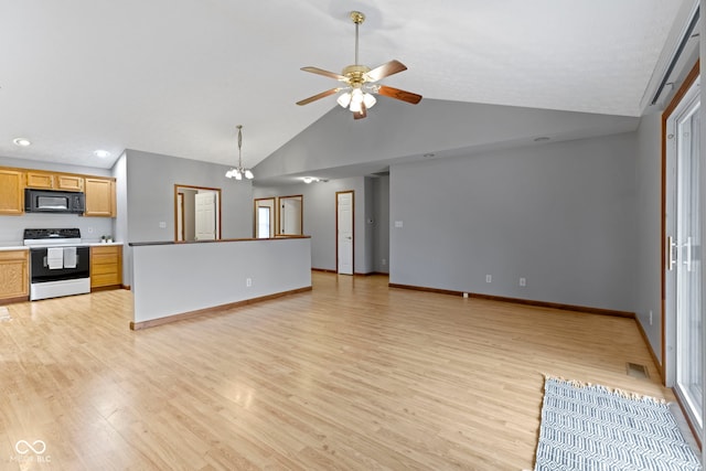 kitchen with range with electric stovetop, high vaulted ceiling, ceiling fan with notable chandelier, and light hardwood / wood-style floors