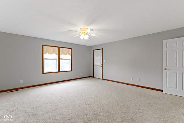 unfurnished room with ceiling fan and carpet flooring