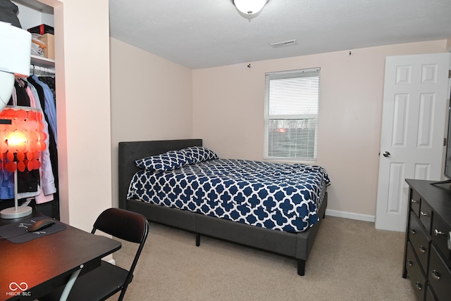 bedroom with light colored carpet