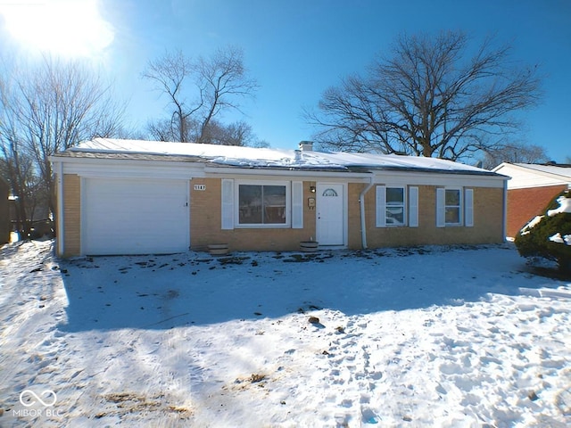 ranch-style house featuring a garage