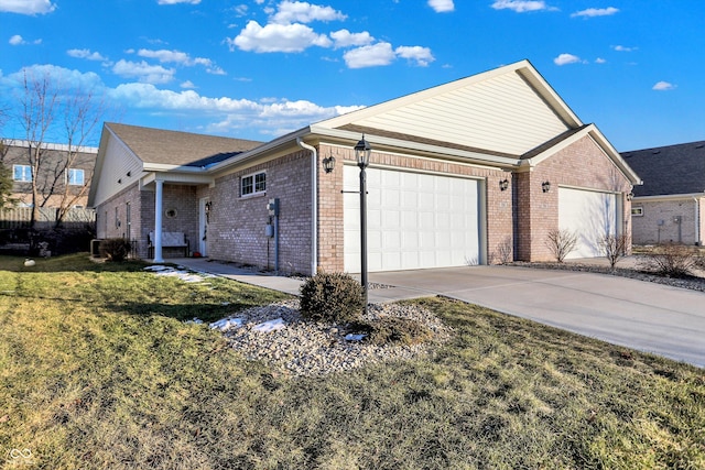 view of front of house featuring a garage and a front lawn