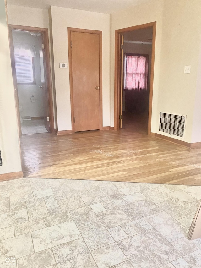 spare room with light wood-type flooring