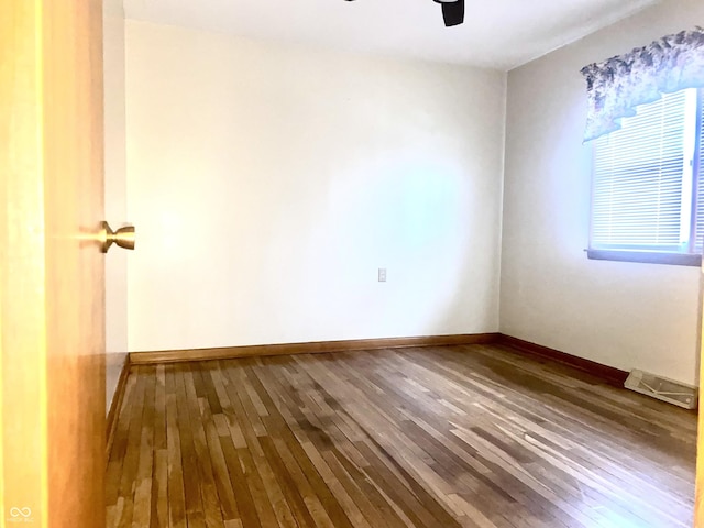 spare room with wood-type flooring and ceiling fan