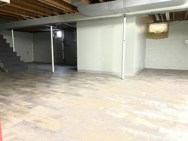 basement featuring hardwood / wood-style floors