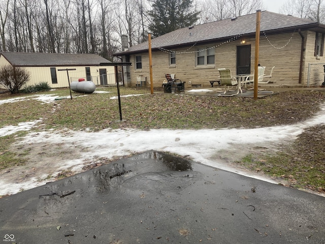 back of house with a patio area